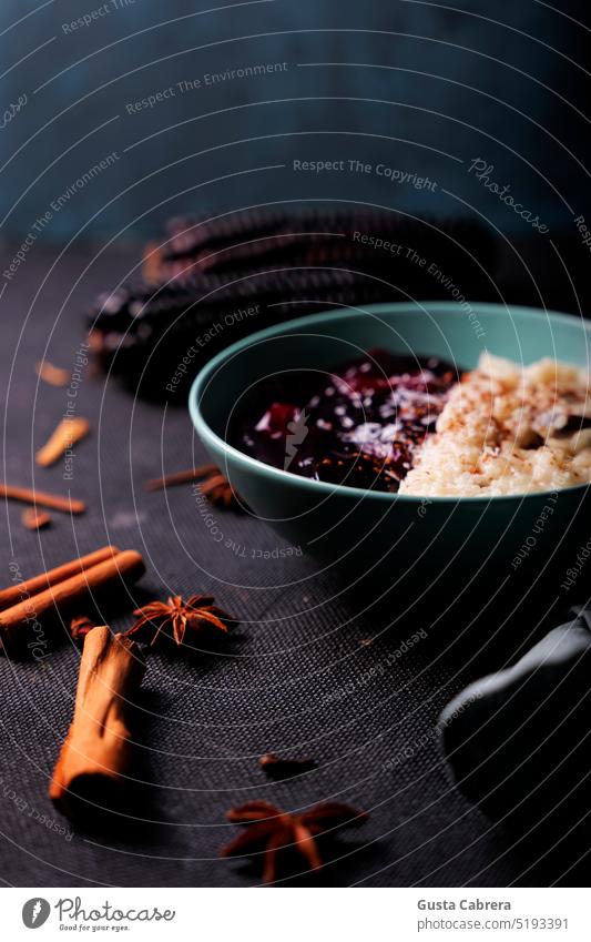 Peruvian dish named mazamorra morada and rice pudding. purplecorn cinamon Rice Milk Food peruvianfood Dessert typical darkfood Colour photo Interior shot