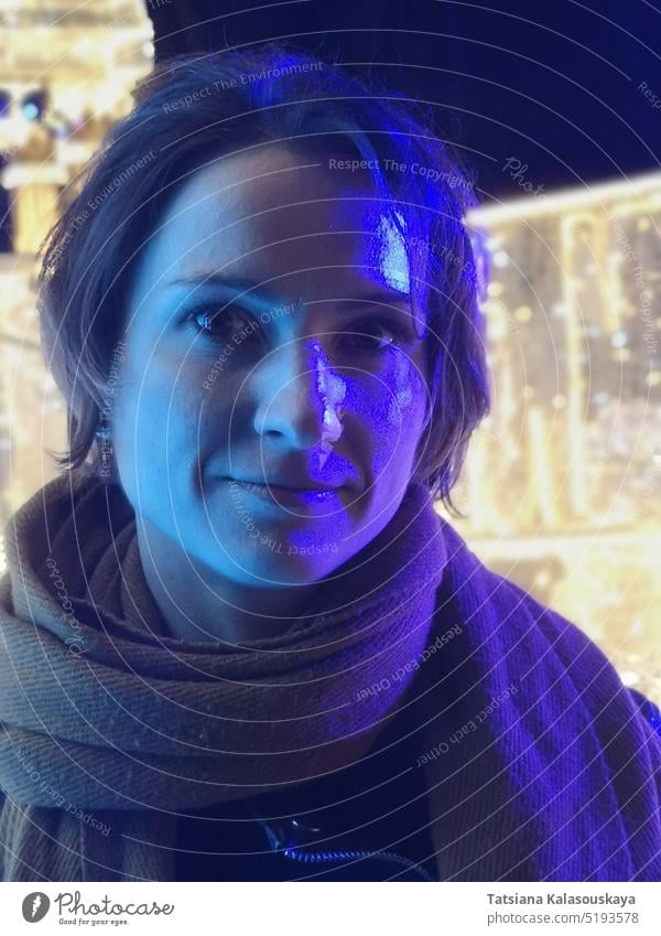 Purple neon light up the face of a young dark-haired woman blue purple Portrait Neon Lighting Neon Colored Illuminated Colors Color Image People Close-up