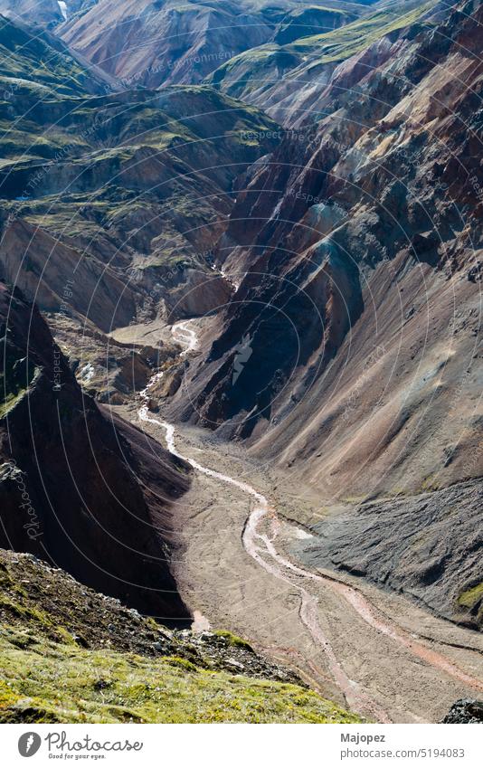 Amazing canyon with a river between mountains ice background adventure hiking beautiful blue clouds europe geology hill iceland icelandic icelandic nature