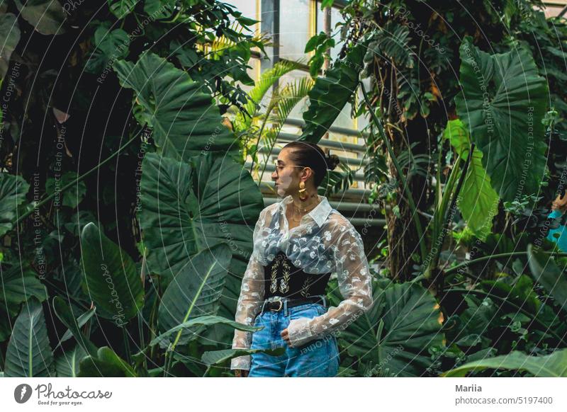 Green tropics in the botanical garden Girl Woman young European Greenhouse Botanical Garden plant Tropical garden palm Palm tree Nature Plant leaf