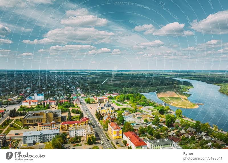 Rechytsa, Belarus. Aerial View Of Residential Houses And Famous Landmarks Of Town: Holy Assumption Cathedral And Holy Trinity Church In Sunny Summer Day.