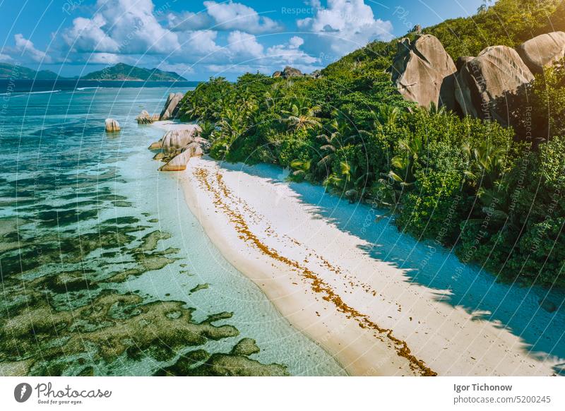 Seychelles, La Digue. Aerial view of beautiful paradise tropical beach Anse Source D Argent in morning soft light. Summer vacation and travel concept holiday