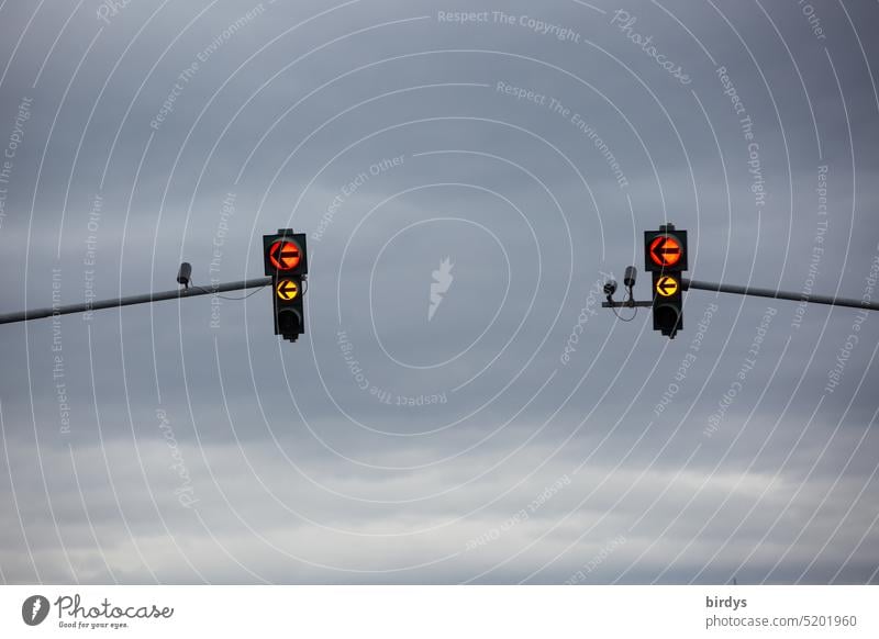 Traffic light just before green phase. Left turn traffic light circuit Beginning Road traffic left turn-off Traffic camera Clouds Switchover phase Red Yellow