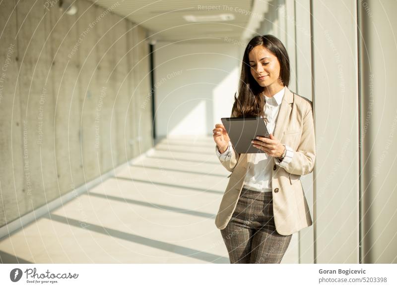 Young business woman at startup office with digital table adult attractive beautiful beauty businessperson businesswoman caucasian colleagues communication