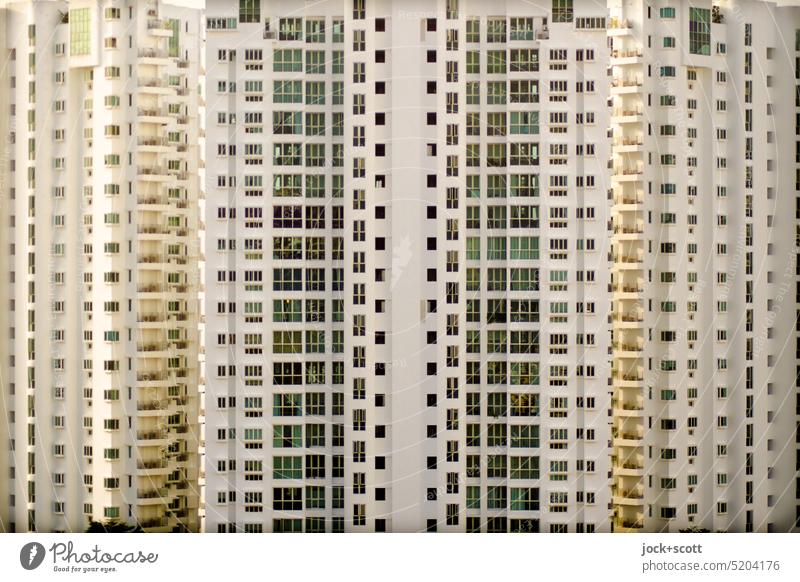 Face of a building with many floors Facade Modern architecture Tower block Window Symmetry Structures and shapes Authentic Sharp-edged dreariness Many Singapore