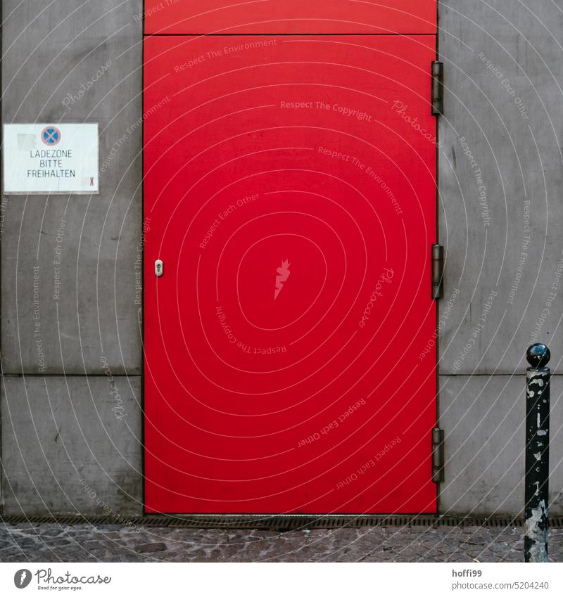 Parking prohibited loading zone with gray wall and red door Red Gray Gloomy loading area no parking sign interdiction Prohibition sign Wall (building) Signage