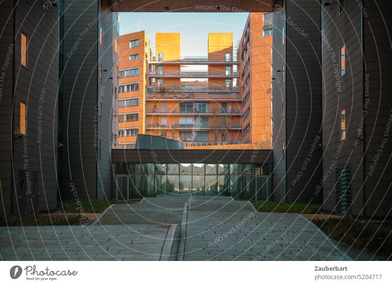 View of skyscrapers in orange, framed by dark skyscrapers, in front stone wave at Potsdamer Platz houses Orange Frame Town urban Capital city Architecture