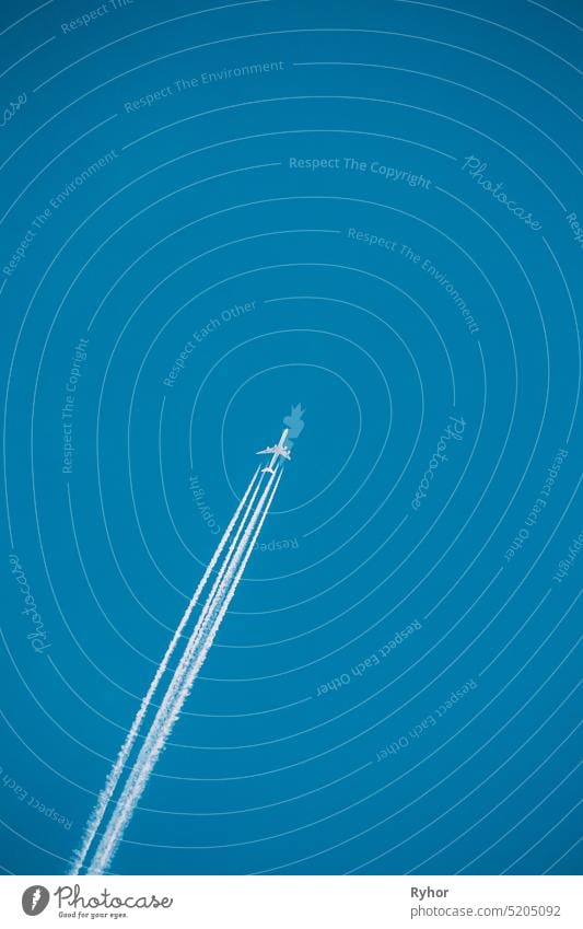 Airplane In The Sky With Plane Trails travel aircraft airliner nobody high airplane journey contrail sky flight smoke jet fly pollution transport fuel