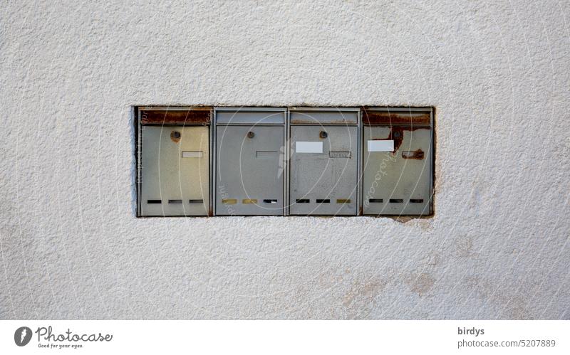 A row of mailboxes in a house wall Mailbox postal delivery orphan forsake sb./sth. Old Vacancy