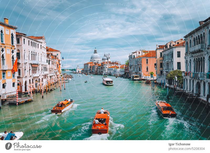 Venice, Italy. Tourist boats in Grand Canal with Basilica Santa Maria della Salute view in background italy cathedral venezia turquoise sightseeing europe