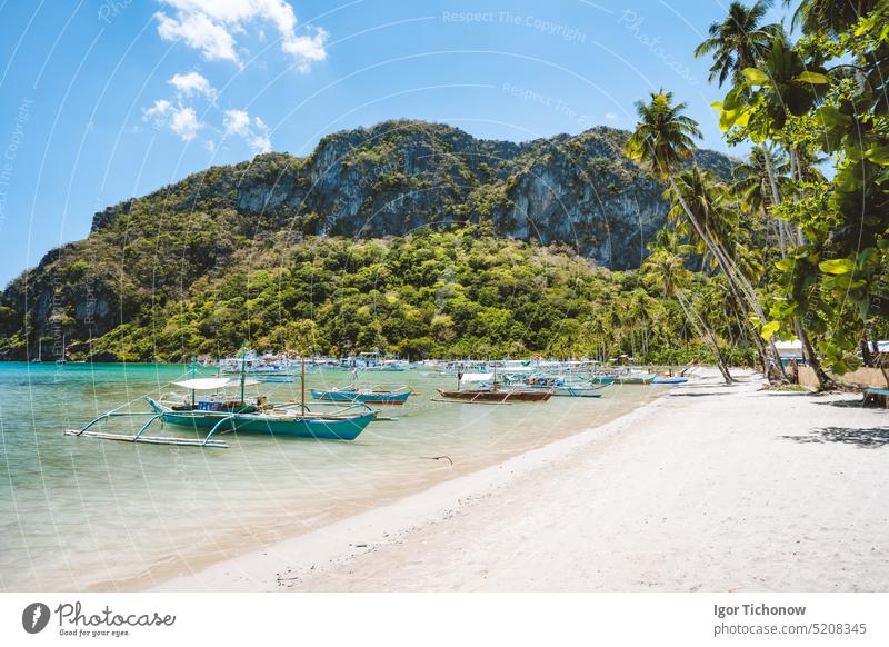 Tourism day trip banca boats on beautiful Corong Corong beach, El Nido. Palawan, Philippines. Summer exotic vacation concept philippines el nido palawan wooden