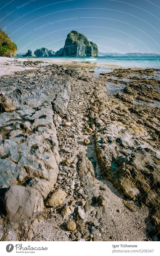 Rocky coastline leading line to gorgeous Pinagbuyutan island in background. Dreamlike landscape scenery in El Nido, Palawan, Philippines palawan beach