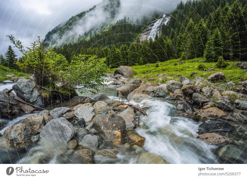 Mountain blue water river and trees landscape natural environment. Hiking in the alps. Grawa Waterfall in Stubai Valley, Tyrol, Austria hiking mountain austria