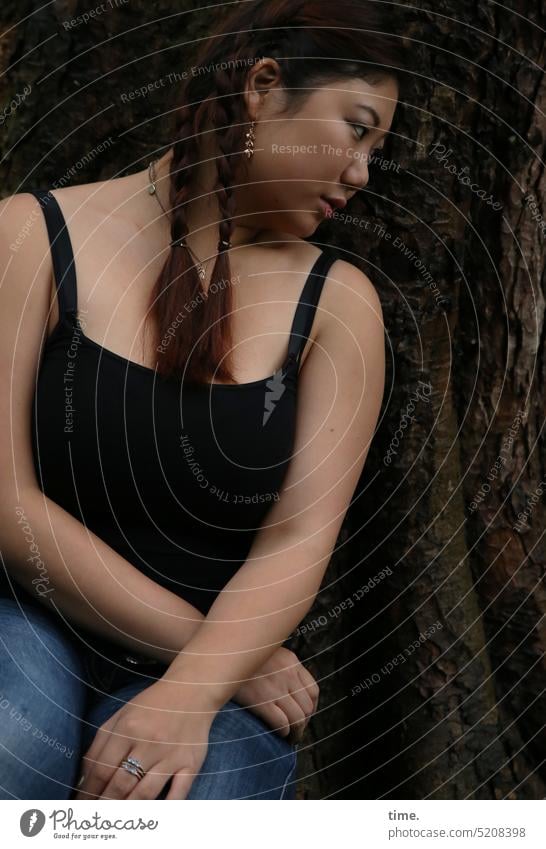 Woman in the forest portrait Feminine Calm Patient Serene Attentive Watchfulness pretty Pride Observe Braids Red-haired Black-haired Ajar Tree Long-haired