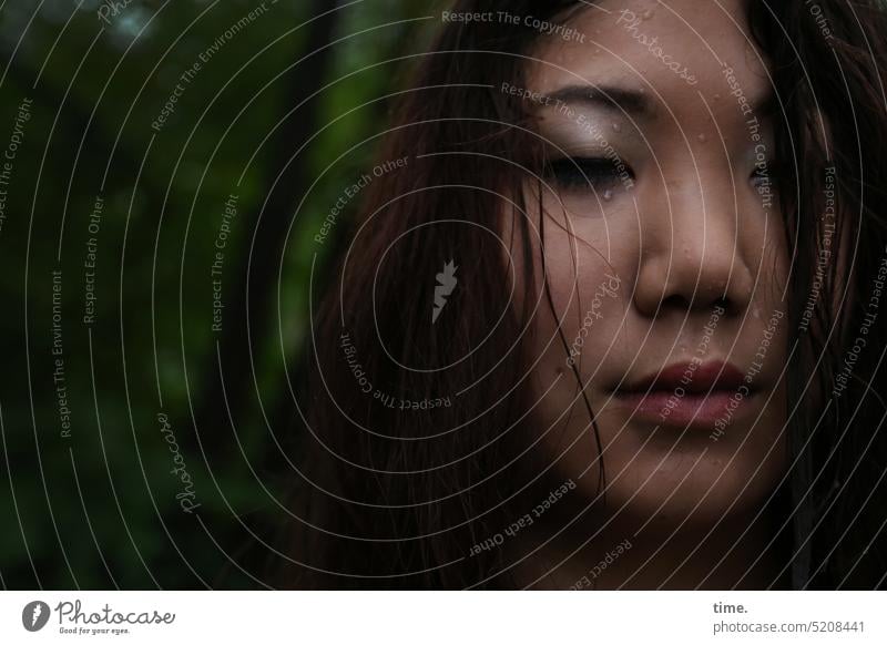 Woman with closed eyes in rain feminine Long-haired Dark-haired Closed eyes somber Moody Grief emotionally melancholy Rain raindrops