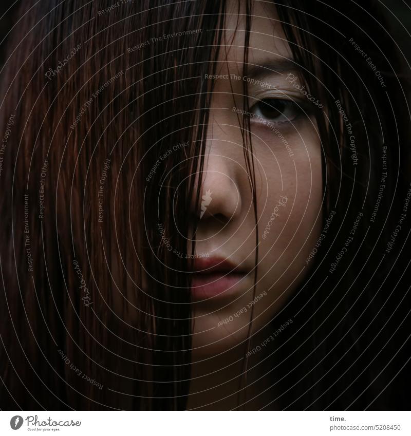 Woman with strand of hair Feminine Dim Dark-haired Skeptical Looking Looking into the camera Strand of hair sad portrait oneeye