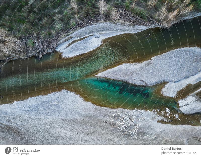 Beautiful Drome River formed from great stones in a mountainous region. A waterfall during the sunset. Aerial Drone Shot adventure amazing ardeche autumn