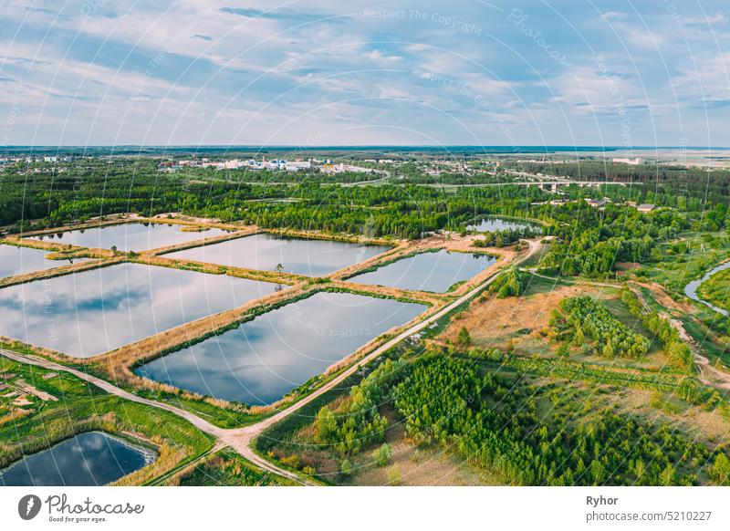 Aerial View Retention Basins, Wet Pond, Wet Detention Basin Or Stormwater Management Pond, Is An Artificial Pond With Vegetation Around The Perimeter, And Includes A Permanent Pool Of Water In Its Design.