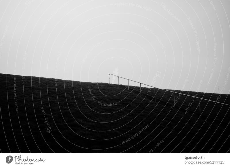 Stairs on the dike Dike dike top staircase rail Upward Banister Deserted Go up Lanes & trails off Loneliness Dark somber Gray