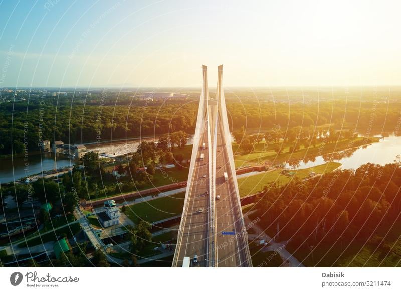 Large cable stayed bridge over river with car traffic, aerial view highway transport city construction transportation poland infrastructure odra wroclaw road