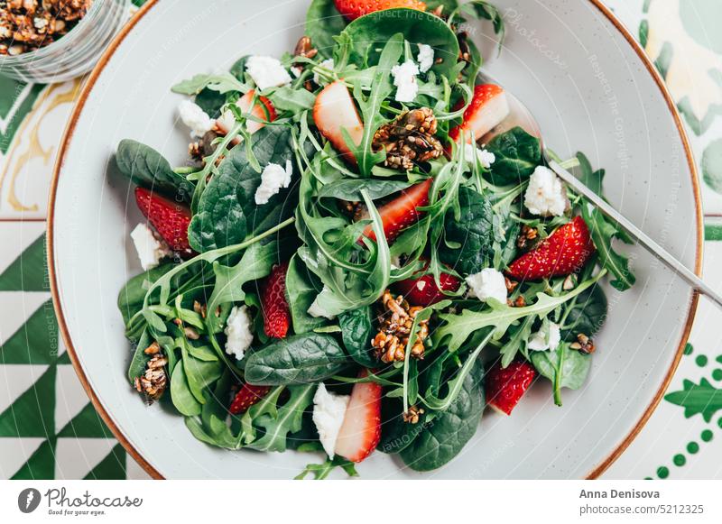 Green Salad with Strawberries, Feta Cheese, Seeds Healthy Strawberry Arugula Summer Salad Pumpkin Sesame Seeds Homemade Roquefort Leaf Rocket Salad Slices Fresh