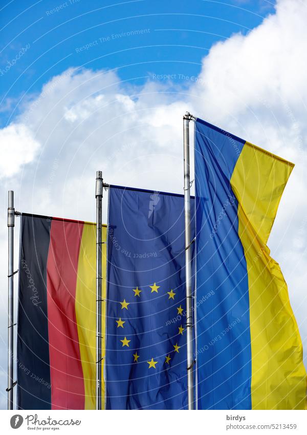 Germany flag , EU flag and Ukraine flag flying side by side in the wind Ukraine war German flag European flag Side by side European Union Attachment Solidarity