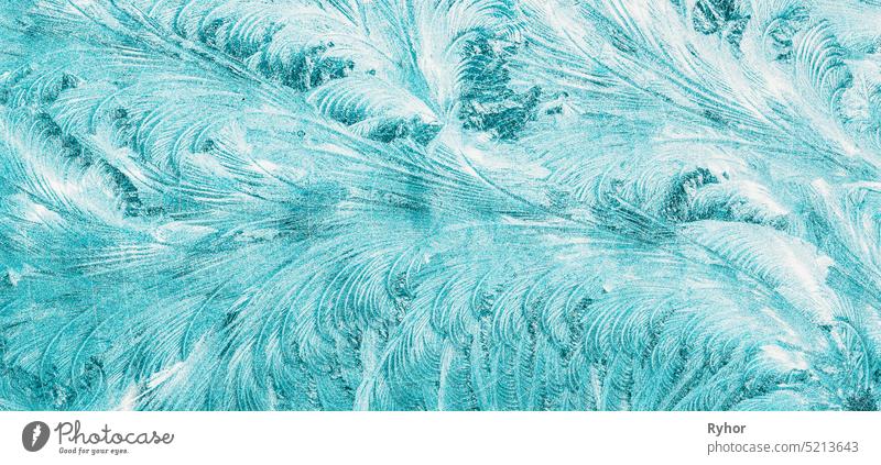 Blue Frosty Glass Ice Background, Natural Beautiful Snowflakes Frost Ice Pattern. Winter Xmas Christmas Abstract Backdrop, Background Or Texture. Turquoise Blue Colour.