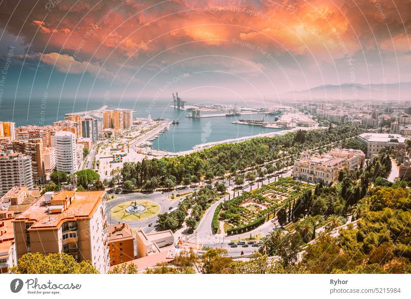 Malaga, Spain. Cityscape Elevated View Of Malaga In Sunny Summer Evening. Altered Sunset Sky Costa del Sol andalusia architecture building city cityscape coast