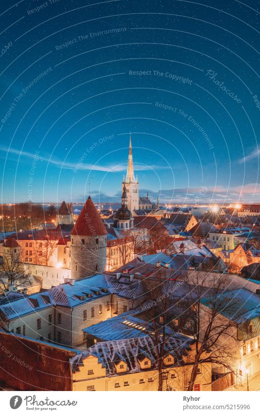 Tallinn, Estonia. Night Starry Sky Above Old Castle Walls Architecture. Cityscape Skyline In Old Town. Winter Evening Night. Famous Landmark. Popular Destination Scenic. UNESCO Heritage. Altered Sky.