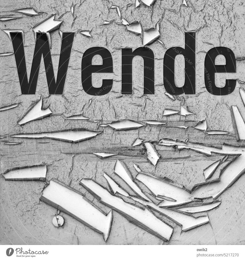 Turning maneuver 1989 Past Turnaround Keyword sign Old Worn out Letters (alphabet) Destruction Transience Black Word Printed letters Flake off Gray