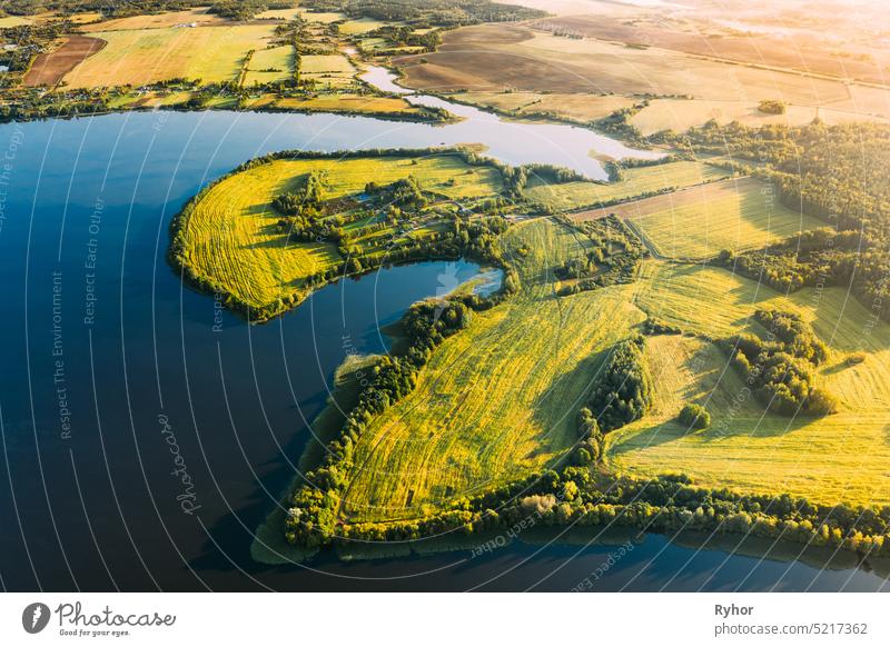 Lyepyel District, Vitebsk Region, Belarus. Aerial View Of Residential Area With Houses In Countryside. Sunny Autumn Morning. Sun Shining Above Town Skyline And Lepel Lake