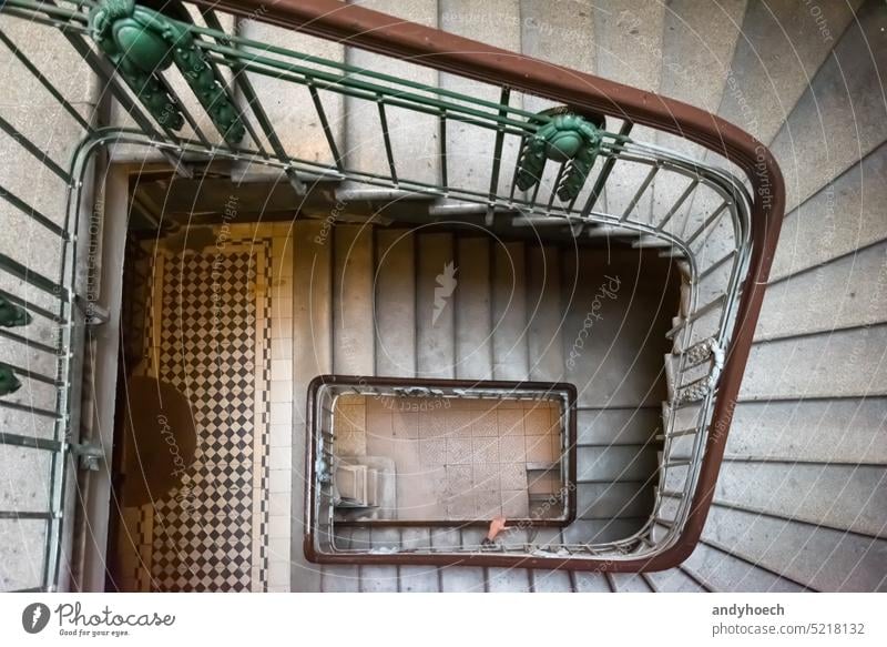 A hand on the old brown banister of a staircase adult ancient antique architecture balustrade beautiful building careful concept concrete construction