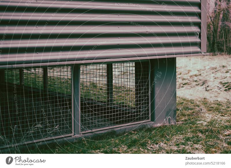 Corner of a functional building, latticed plinth, metal facade above it Building Pedestal Grating Facade Metal Gloomy bleak Empty Gray somber Charmless Meadow