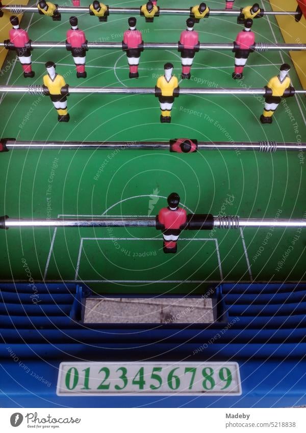 Table football game in front of a snack bar in the main street of Oerlinghausen near Bielefeld on the Hermannsweg in the Teutoburg Forest in East Westphalia-Lippe