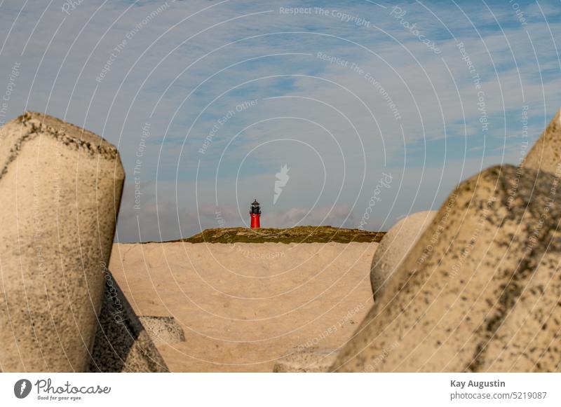 Hörnum lighthouse Lighthouse Navigation mark North Sea North Sea coast tetrapods coastal protection Exterior shot Sky Landscape Ocean Nature Beach Clouds Sand