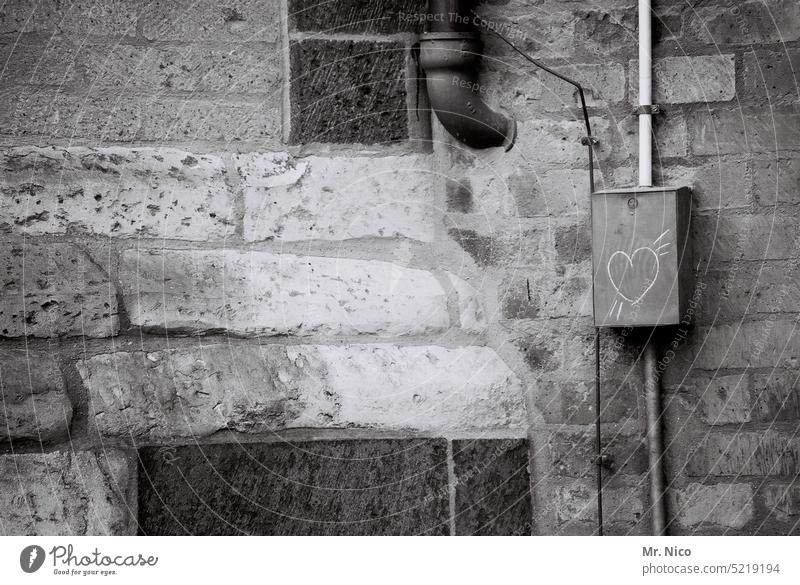 lovebox Facade power box Cable Drainpipe Downpipe Gray House (Residential Structure) Old building Heart Symbols and metaphors masonry Building Architecture