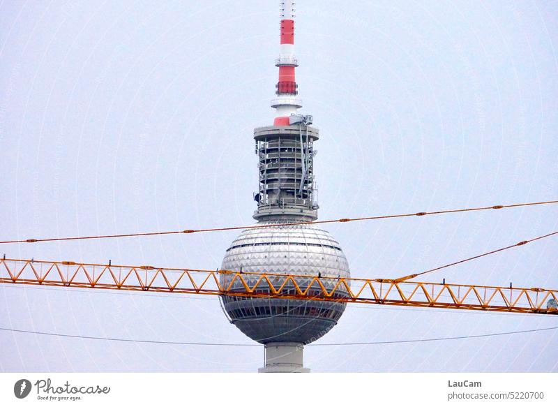 Berlin, a city in constant change - construction crane in front of television tower Alexanderplatz Television tower Construction crane construction works