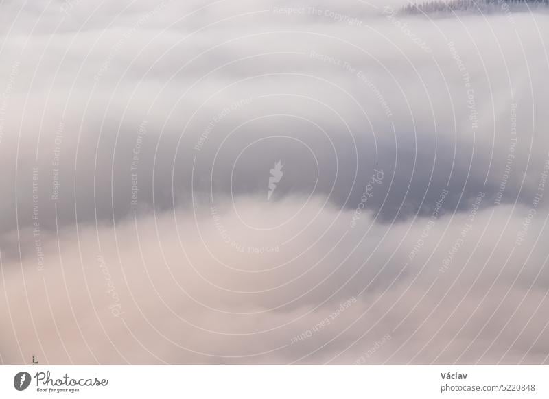 Morning clouds rolling over the scenery and mountains over the Czech Republic creating different formations based on temperature, pressure and airflow. Meteorology