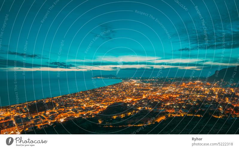 Terracina, Italy. Top Cityscape In Evening Night Illuminations sea italian province of Latina copy space night travel temple church famous cityscape italy