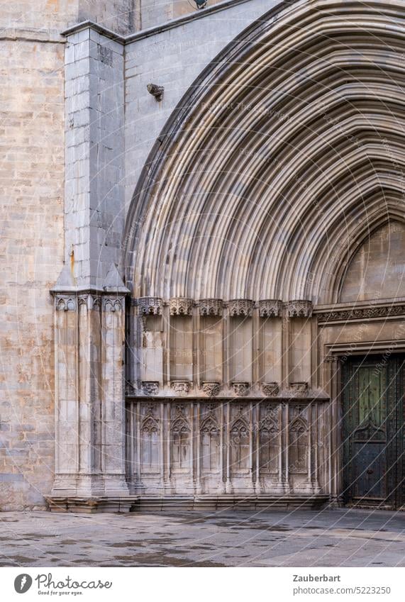 Gothic church portal in Catalonia, bold arches and dark green door, golden stones Church Portal Gothic period gothic Catalan Gold Green Belief Catholic Entrance