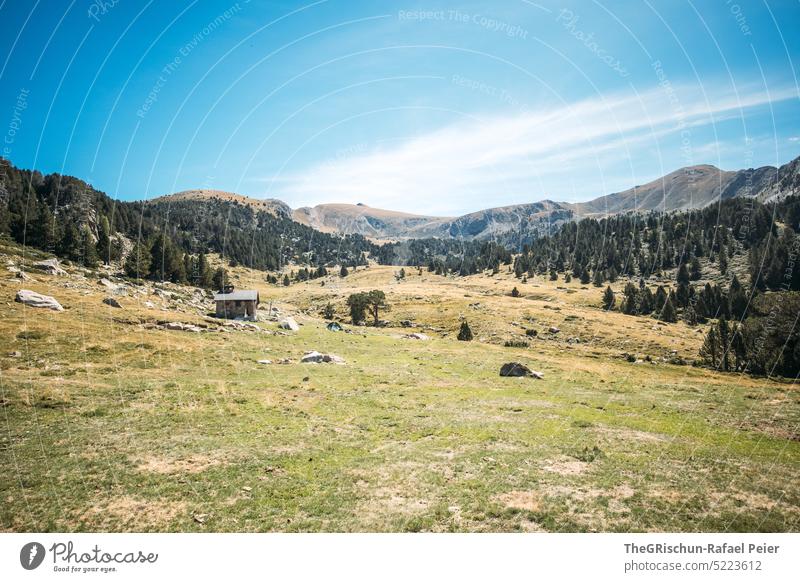 Alpine hut in pasture in front of mountains Alps Andorra Hiking Discover Mountain Hill Landscape Nature Colour photo Summer Deserted Tourism Beautiful weather