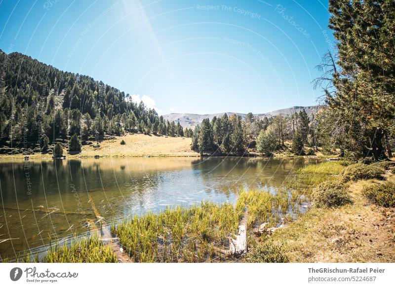 Lake with mountains in background Alps Andorra Hiking Discover Mountain Hill Landscape Nature Colour photo Summer Deserted Tourism Beautiful weather stones