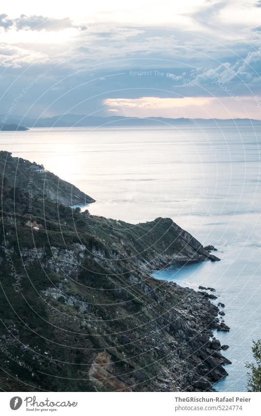 cliff by the sea with clouds in the sky Sun Hill Ocean Water Summer Blue Nature Bay donostia san sebastian Spain San Sebastián Basque Country Landscape coast