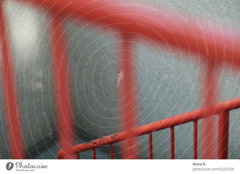 Red stair railing with traces of rust and light coming from left side Banister Staircase (Hallway) Light incidence from the left Stairs