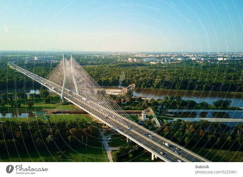 Large cable stayed bridge over river with car traffic, aerial view highway transport city construction transportation poland infrastructure odra wroclaw road