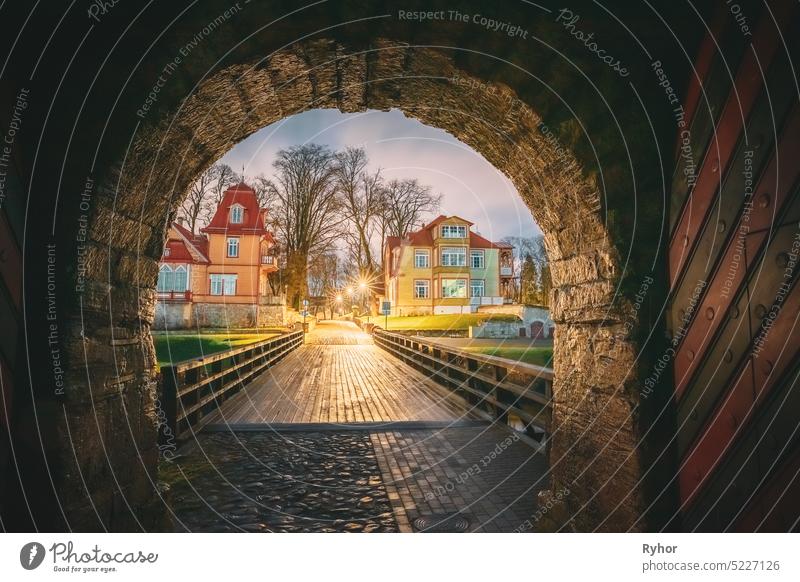 Kuressaare, Saaremaa Island, Estonia. Passage Entrance From Episcopal Castle. Traditional Medieval Architecture, Famous Attraction Landmark. Episcopal Castle In Night. Traditional Medieval Architecture, Famous Attraction Landmark