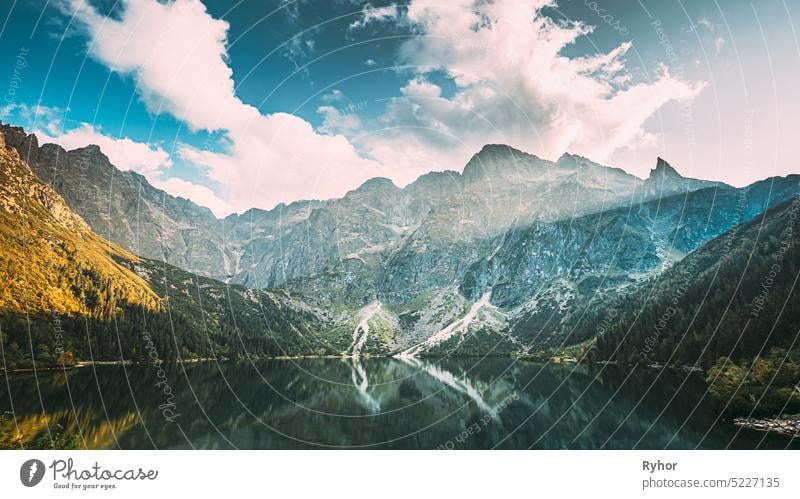 Tatra National Park, Poland. Famous Mountains Lake Morskie Oko Or Sea Eye Lake In Summer Evening. Beautiful Sunset Sunrays Above Tatras Lake Landscape