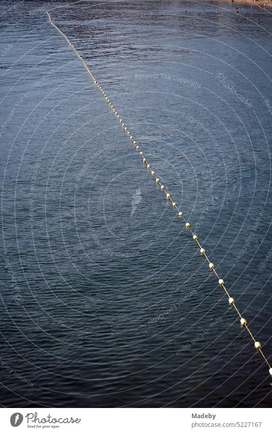 Floats and buoys mark the swimming area at Güzelcehisar beach near Inkumu in Bartin province in summer on the Black Sea in Turkey float String Yellow Mysterious