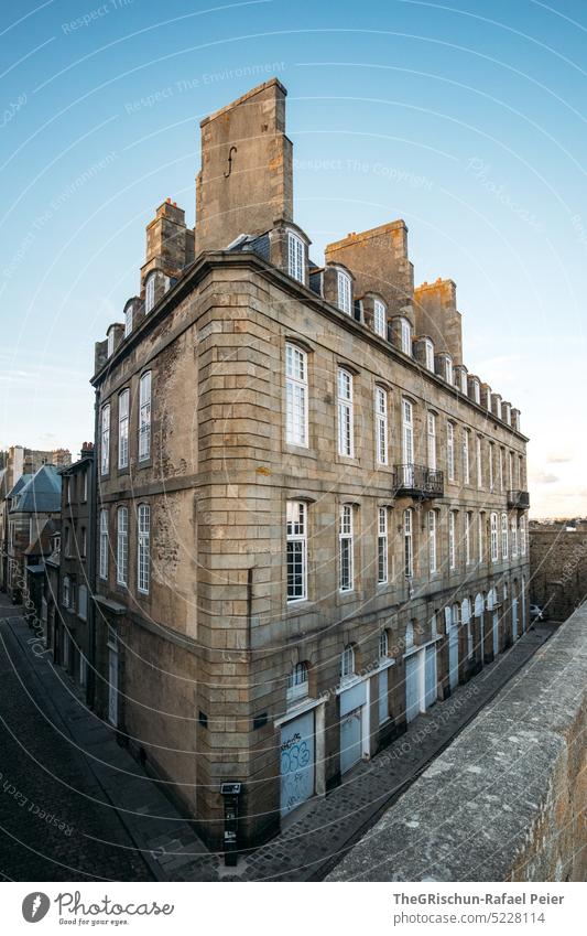 Corner house with wall in foreground against blue sky Wall (barrier) Town France travel Tourism Brittany Vacation & Travel Landscape Exterior shot Sky Deserted