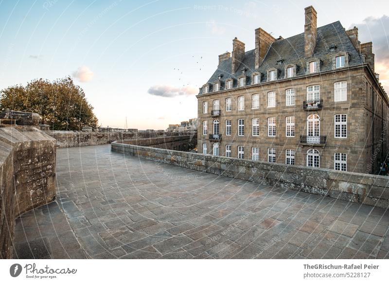 Stone floor with house in front of evening atmosphere Wall (barrier) Town France travel Tourism Brittany Vacation & Travel Landscape Exterior shot Sky Deserted